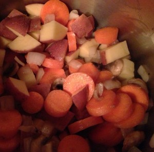Add the sliced carrots and cubed potatoes