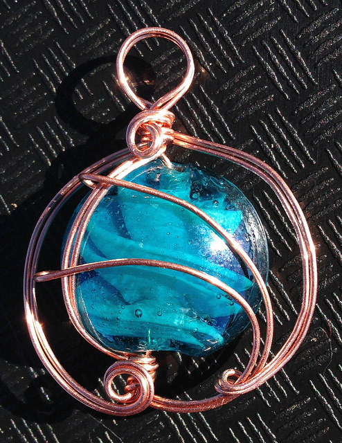 A copper wire-wrapped bead - Cheri is an excellent teacher